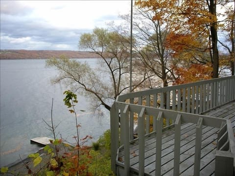 View of Cayuga Lake showing the Twin Pines' dock in autumn from 25' long deck.