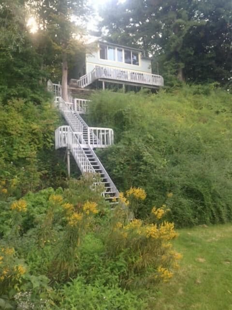 A sturdy staircase connects the cottage with the lakefront.