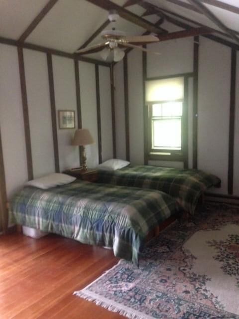 The upstairs west bedroom offers 2 twin beds.