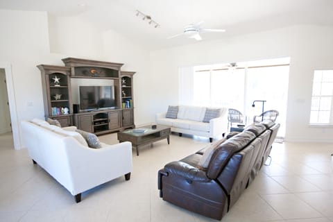 Main living room has plenty of space for your large family. Reclining couch too!