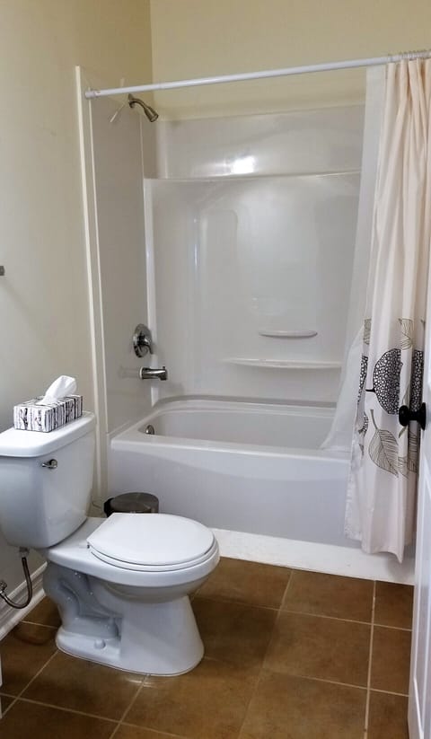 Combined shower/tub, hair dryer, soap, toilet paper