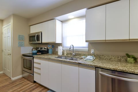 Ample kitchen.  Nice granite. Good quality dishwasher and other appliances. 