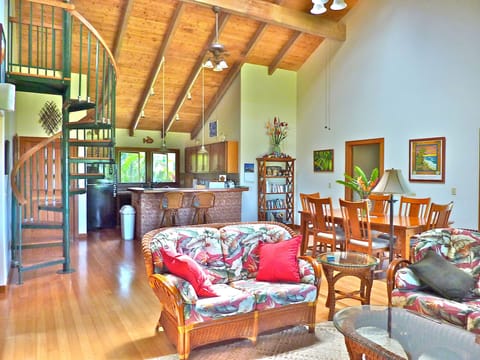 Living room, dining area, kitchen and spiral staircase to sleeping loft,