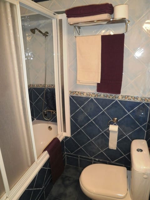 Combined shower/tub, hair dryer, towels, soap