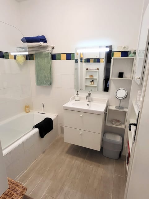 Combined shower/tub, hair dryer, towels, soap