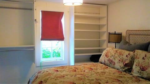 Main bedroom with queen bed and built in closets
