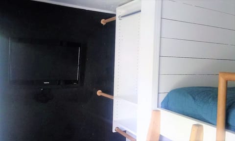 Bunk room built in closet and tv equipped with Roku and DVD.