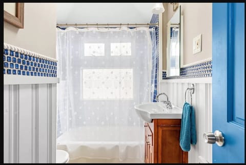 Combined shower/tub, hair dryer, towels, soap