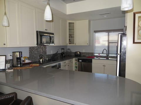 kitchen has a bar and open floor plan