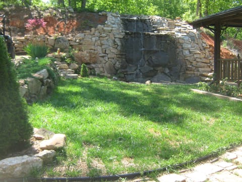 View of waterfall from walkway leading to cabin.