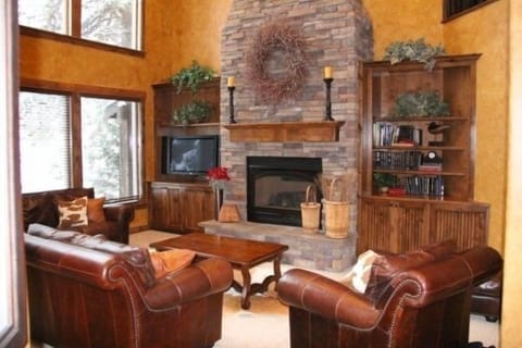 2 story great room with floor to ceiling Rock Fireplace