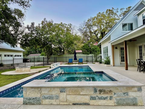 View of the pool area from the hot tub. 