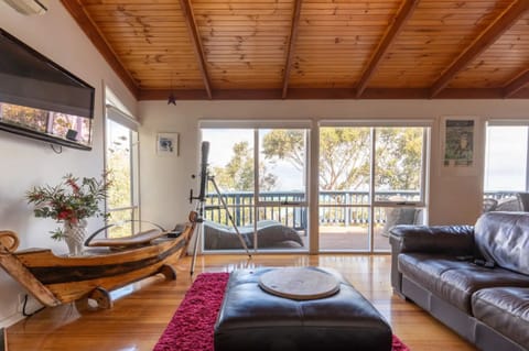 Lounge with open fire and ocean view