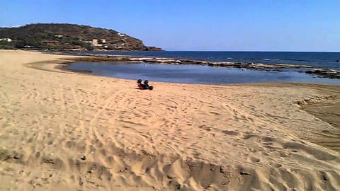 On the beach, sun loungers, beach towels