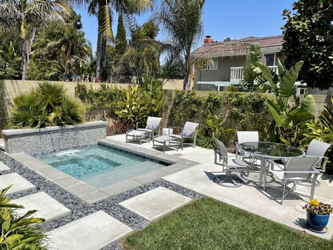 Large spa in private backyard in single family home one mile from the beach.