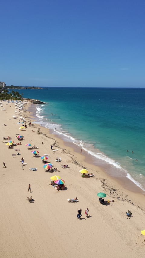 On the beach, sun loungers, beach towels