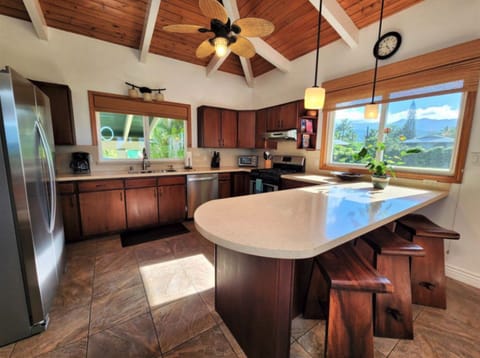 Open Kitchen with Hanalei Mountain Views - Stay connected to the view and your crew while creatin gourmetg meals and tropical snacks in this well-provisioned kitchen.