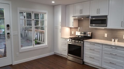 All new stainless steel appliances and marble countertops.