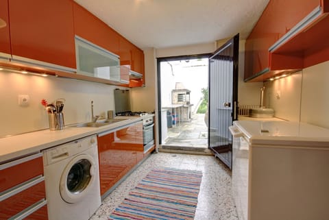 Downstairs Kitchen w/ Barbeque set up outside