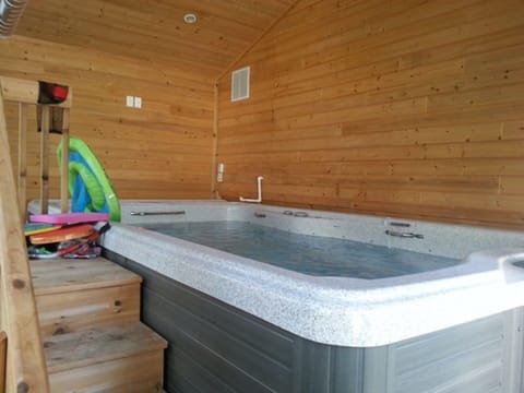 Spa Room with oversized swim spa. Cedar walls that smell so good. Room for 8.