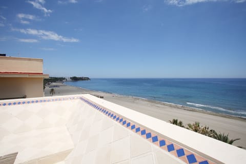 On the beach, sun loungers, beach towels