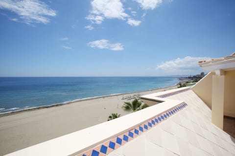 On the beach, sun loungers, beach towels