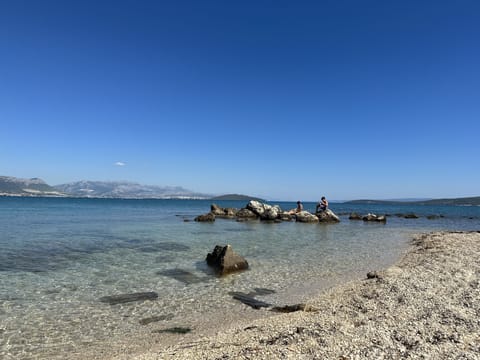 On the beach, sun loungers, beach towels