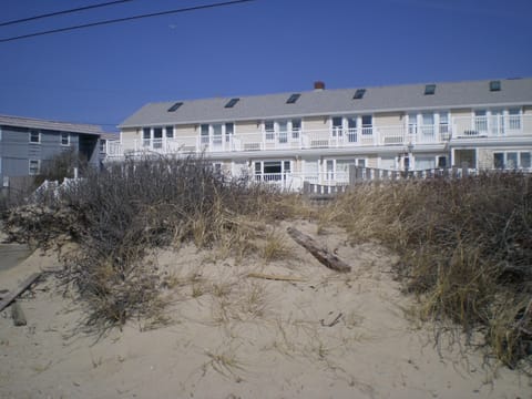 Unit top floor end unit.  on left This photo was taken standing on beach 