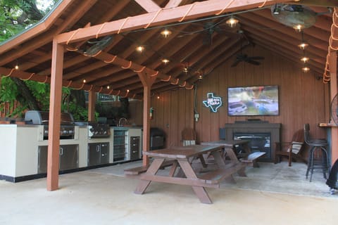 Cantina with outdoor kitchen and large screen TV