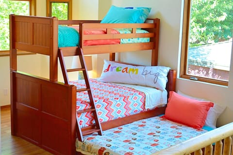 Brand new triple bunk bed with pillow tops and new linens 