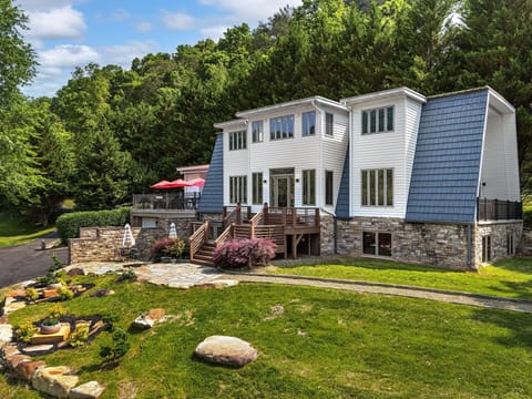 Three stories and great outdoor living spaces all overlooking the river!