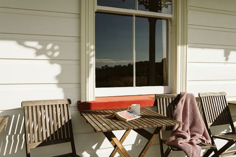 A sunny spot on the wrap-around veranda to enjoy late afternoon sun and a boot