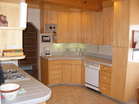 Kitchen, complete with appliances, place settings, cookware etc. 