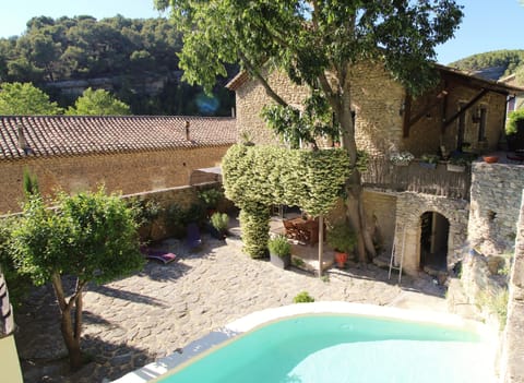 The house, the court and the pool. Cottage on court/pool level.