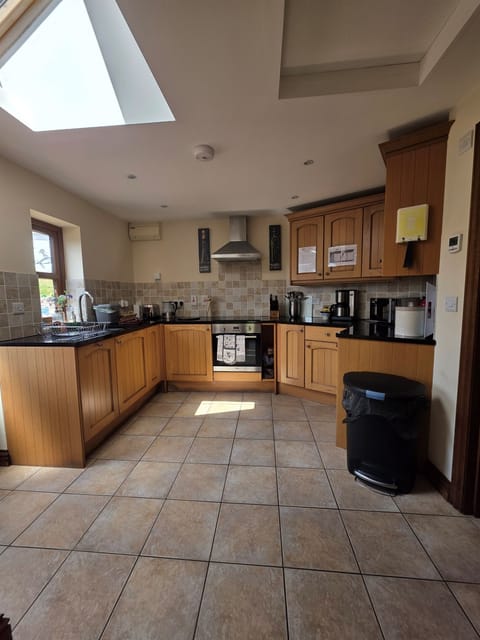 Fully equipped kitchen including: induction hob & oven, drinks station, microwave, dishwasher, toaster, small fridge/freezer (with a standard fridge by the stairs in the lounge).