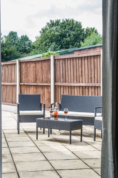 outside yard space, decking area, with more seating. 
