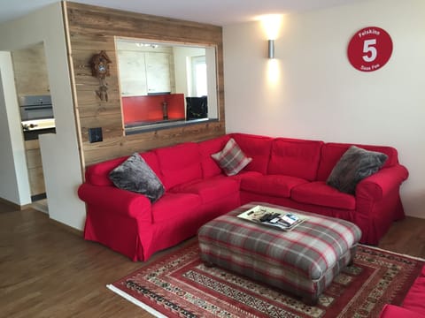 lounge with window into kitchen