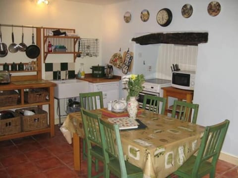 Lovely original classic cottage kitchen with dining space for 6 and high chair.