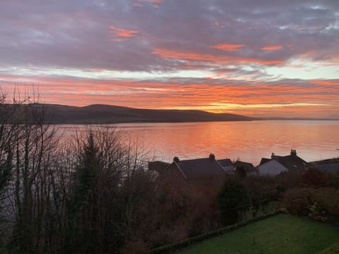 A colourful morning sky from shore cottages