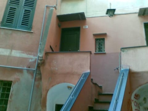 Two windows of the fishing harbor Apartment in Camogli