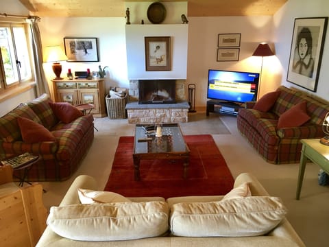 Large sitting room with fire and flat screen TV with Sky / DVD