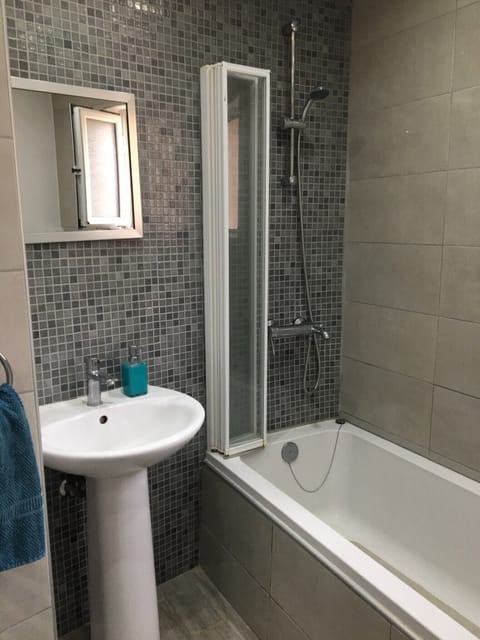 Combined shower/tub, hair dryer, towels, toilet paper