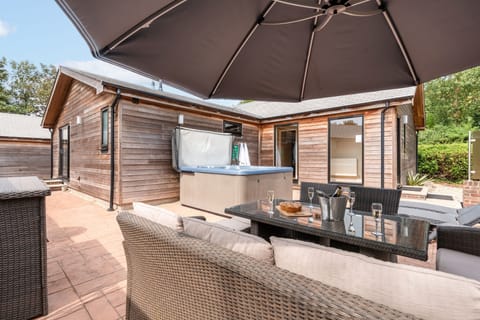 Patio are with Private hot tub and outside seating for 10