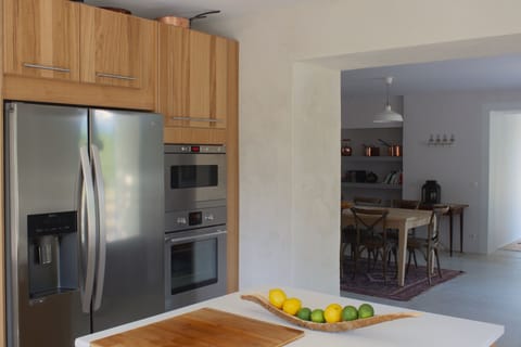 Kitchen, with island and dining room.