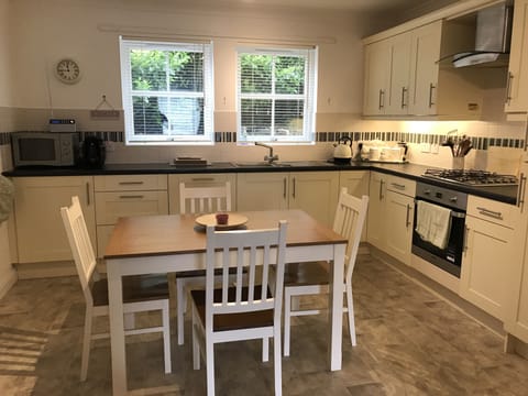 Large well equipped kitchen with extending  Dining table, comfortably seating 6