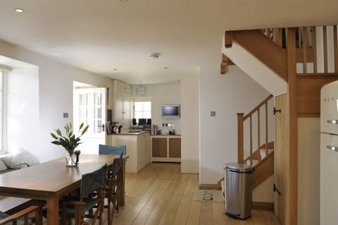 Kitchen and utility area with washing machine and tumble drier