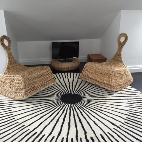 Chill out area in galleried bedroom