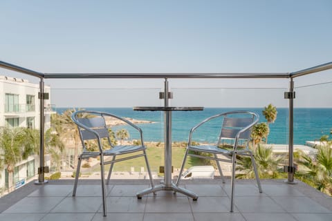 Relax on the private apartment balcony overlooking the sea