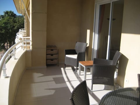 spacious south facing balcony with table 6 persons