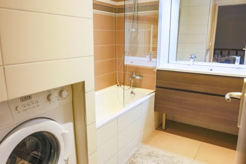 Combined shower/tub, hair dryer, towels, toilet paper